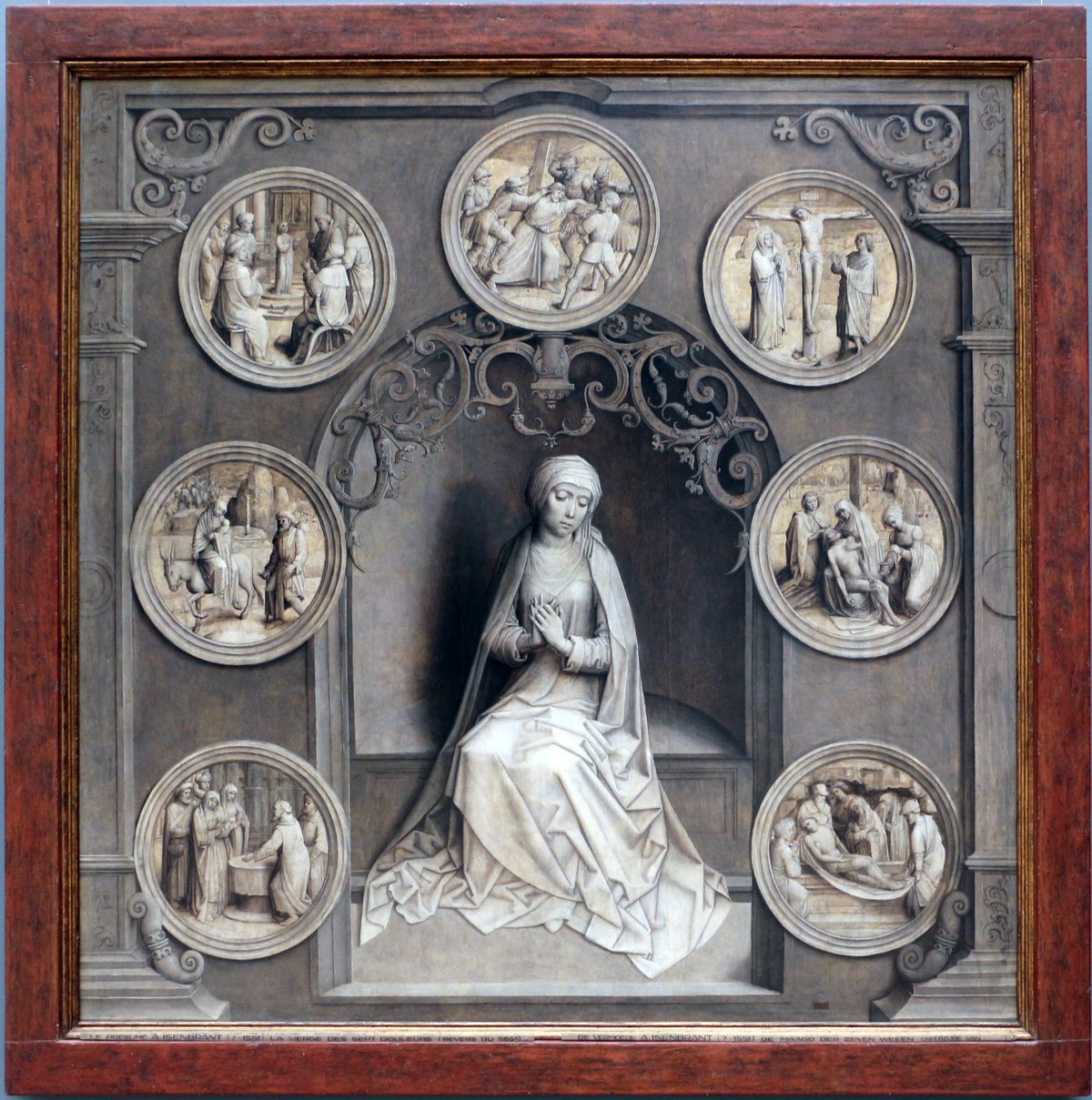 Adriaen Isenbrant's Our Lady of the Seven Sorrows: Mary kneeling in sorrow at the center, surrounded by the seven roundels of her sorrows.